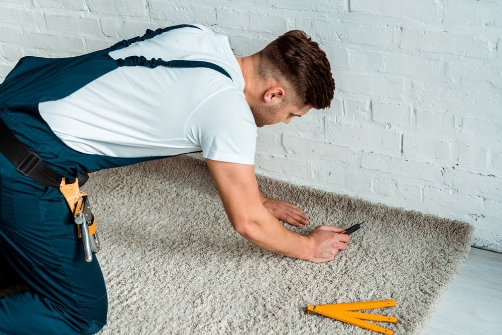 Cleans floor and desk. Hand of asian chinese woman wiping work d