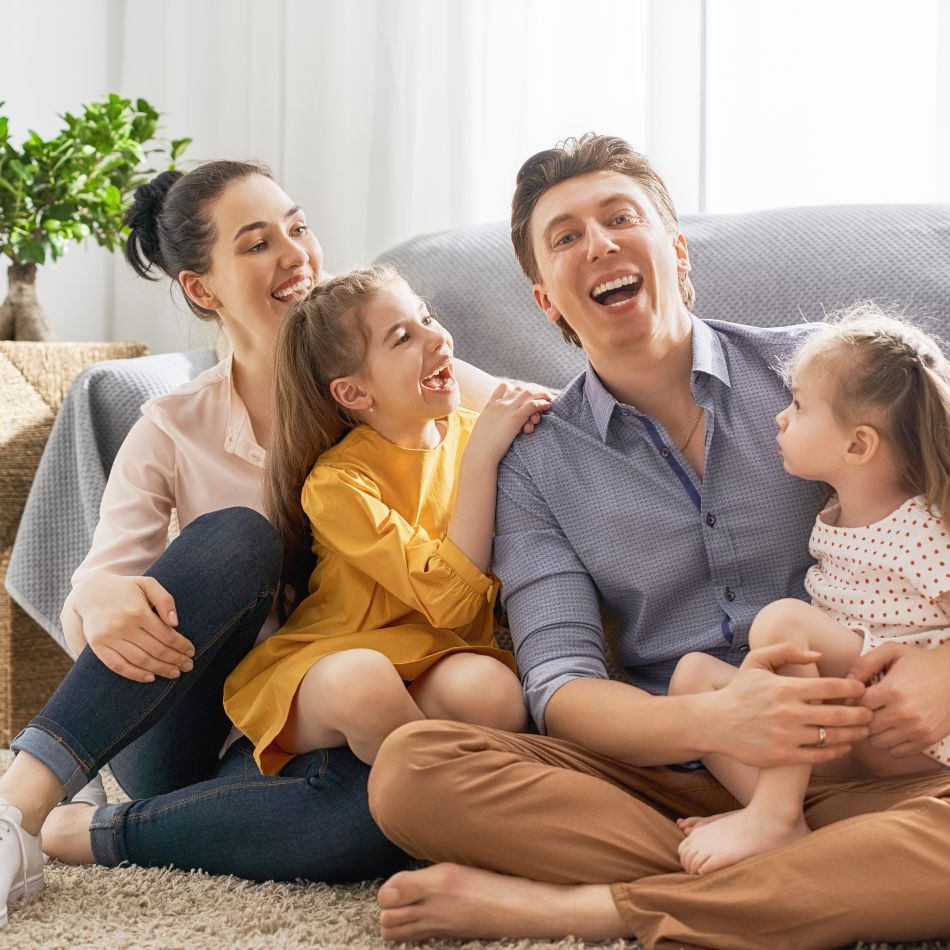Family relaxing in a spotless home after professional house cleaning service